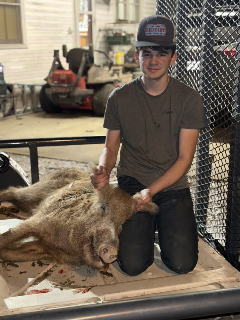 Son with his first hog!